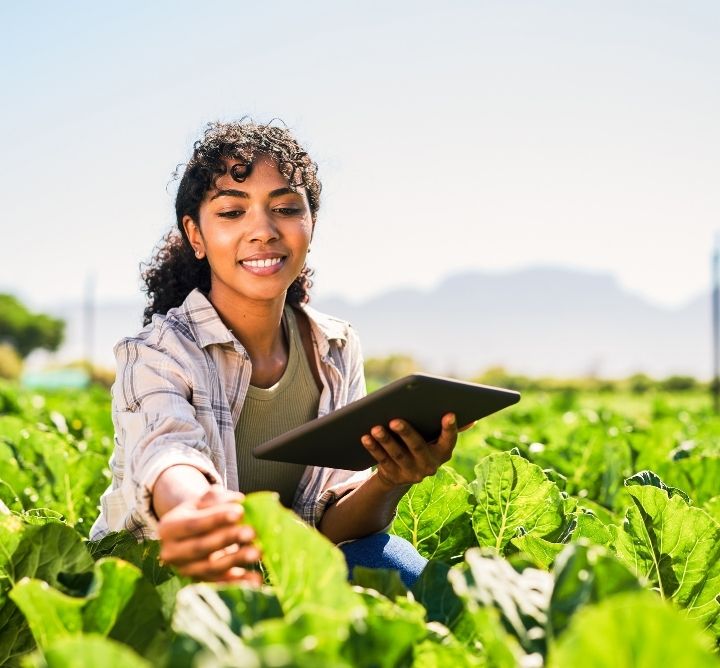 Woman working on plants. 